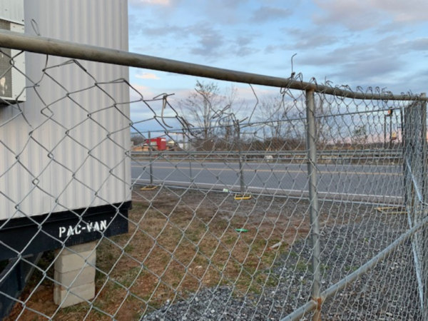 problem-with-chain-link-fencing Broken and jagged fence showing one if the problems with chain link fencing